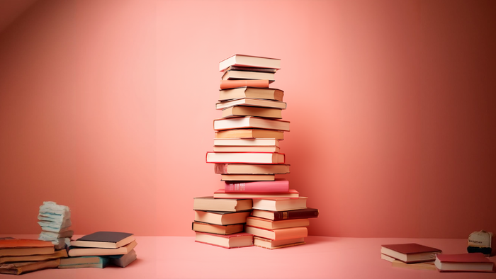 Collection of books stacked in a tower.