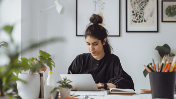 Student studying at her desk with a laptop. 